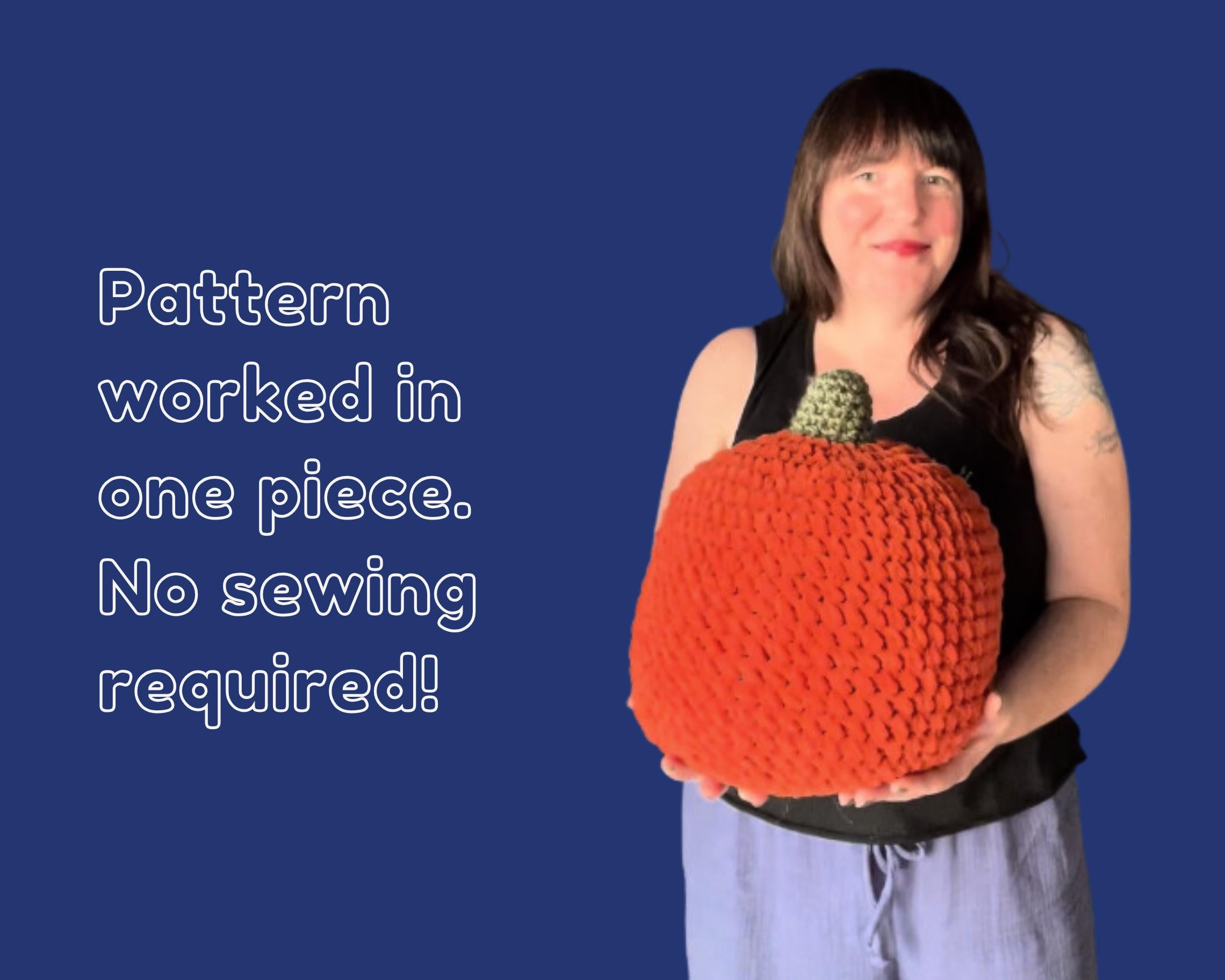 Person holding a large crocheted pumpkin with text on a blue background